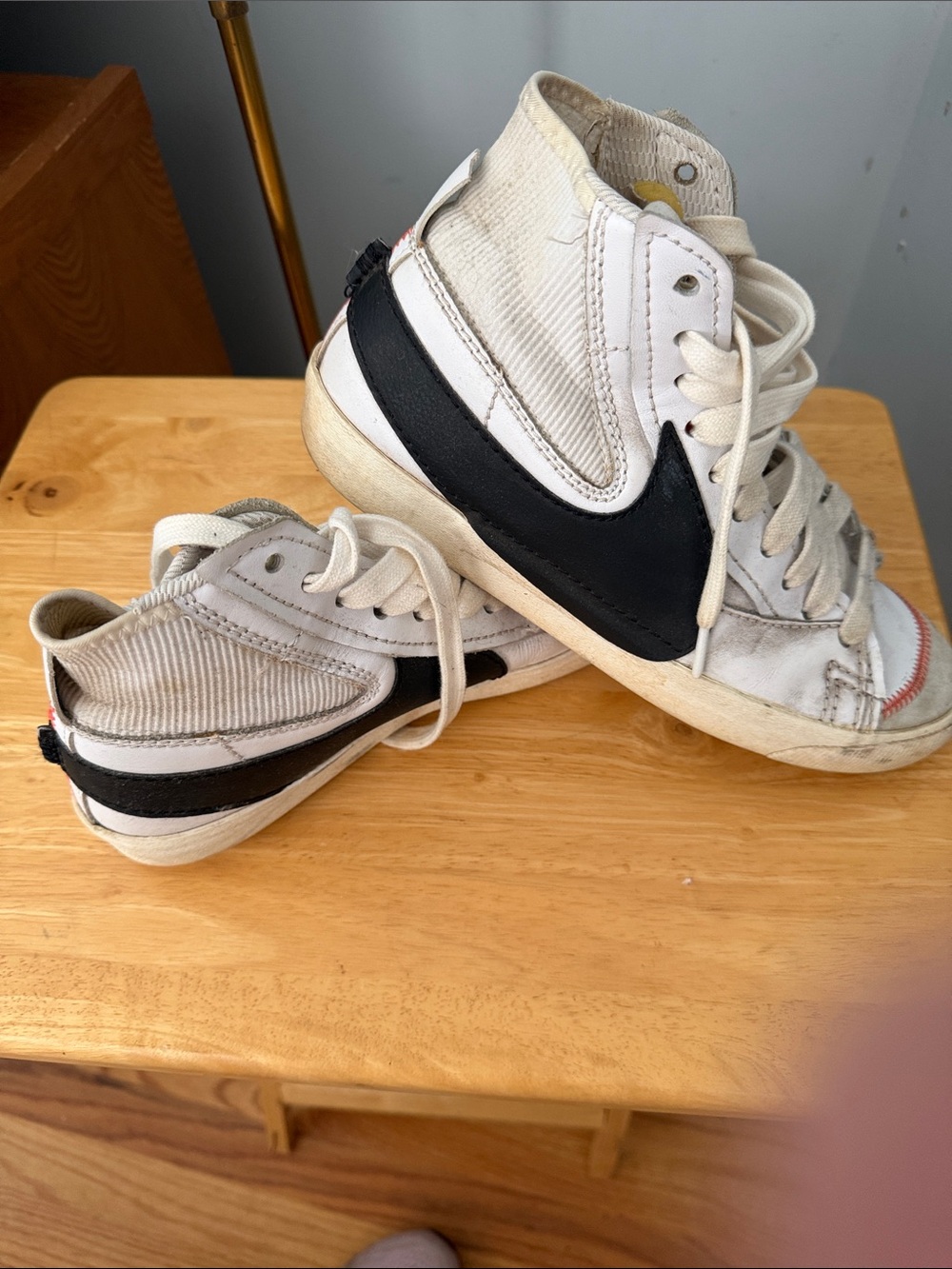Nike White High-Top Sneakers with Black Swoosh